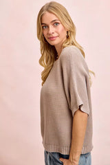 Side view of washed mocha knit top with short dolman sleeves and ribbed hem.