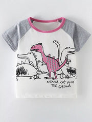 Front view of a white children's shirt with gray raglan sleeves, pink trim, and dinosaur graphics