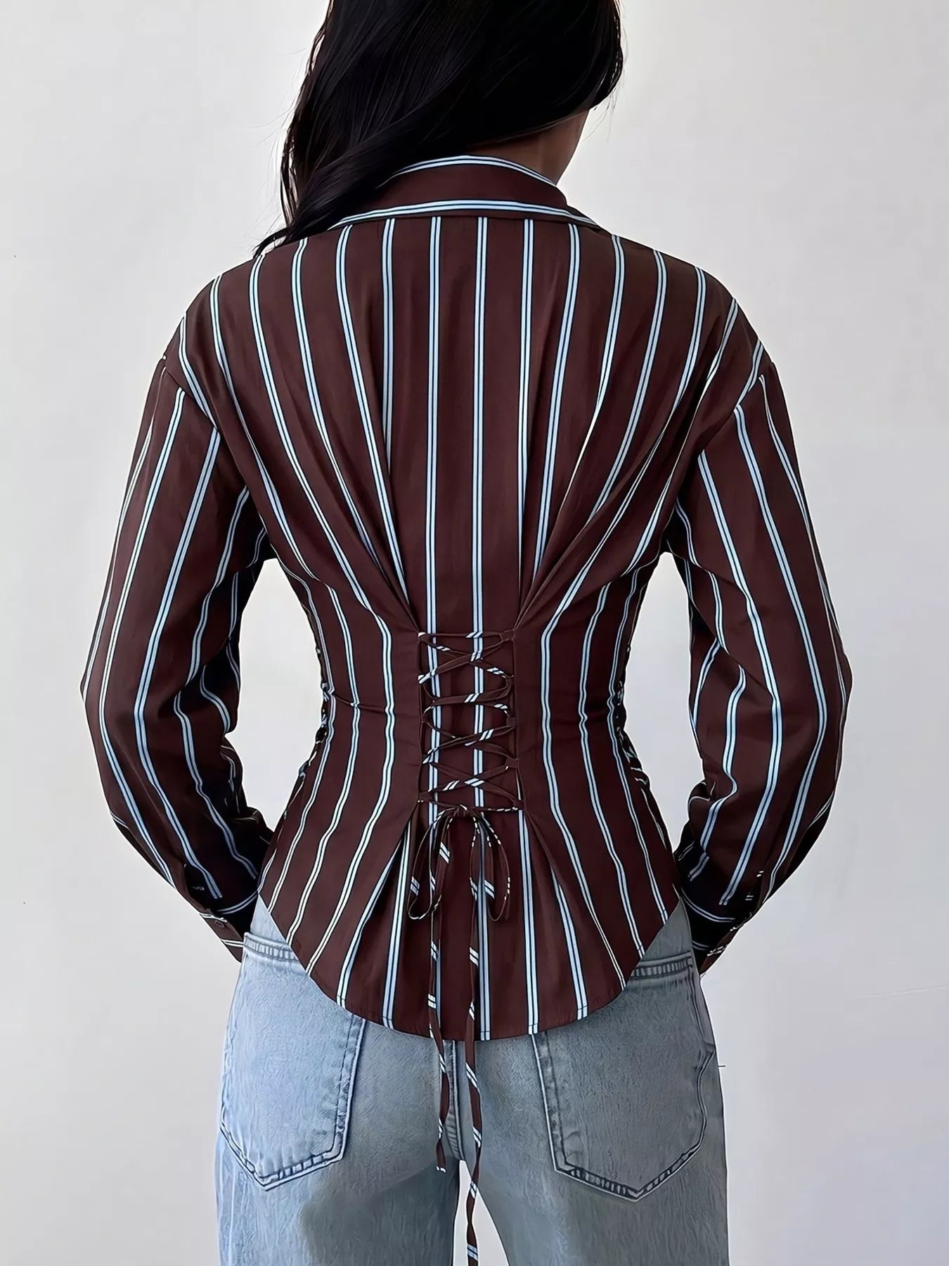 Back view of chocolate striped slim fit shirt with lace up back and long sleeves