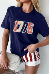Women's navy round-neck T-shirt featuring a patriotic appliqué-style 1776 graphic with red, white, and blue details
