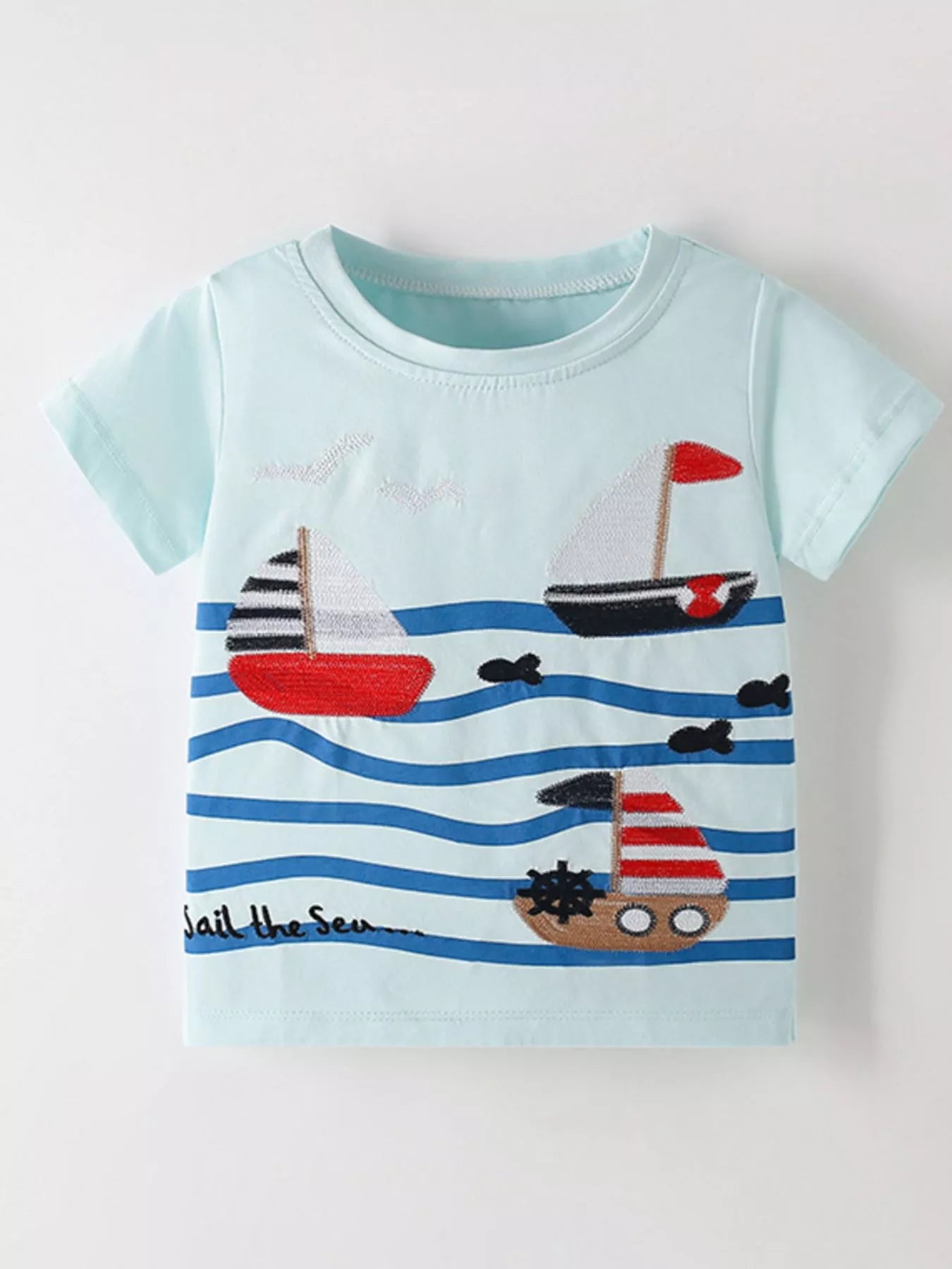 Front view of a mint blue children's short sleeve shirt with embroidered sailboats over blue waves