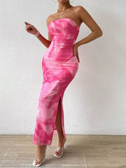 Model wearing fuchsia pink tie dye ruched bodycon tube slit dress full view