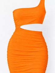 Fluorescent orange one shoulder cutout ruched bodycon mini dress laid flat in a close angled front view