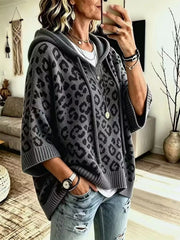 Front angle view of gray leopard print oversized hooded knit sweater with wide sleeves