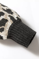 Close up detail of the ribbed cuff on the gray and black leopard print baggy sweater.