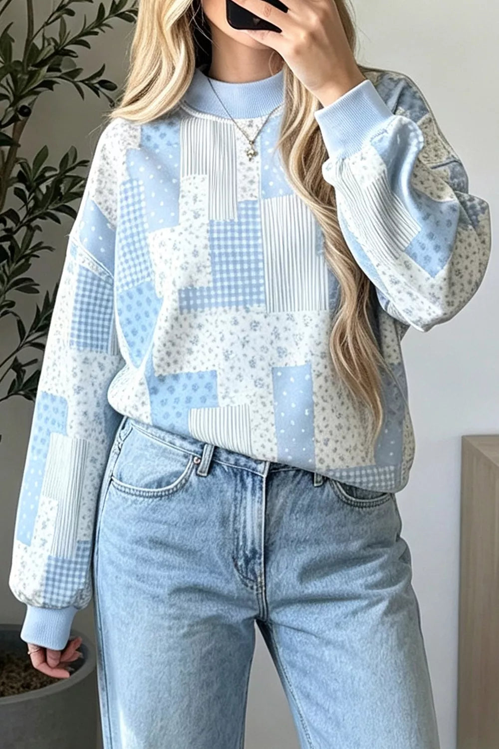 Light blue vintage patchwork dropped shoulder sweatshirt with floral, gingham and striped panels, front view