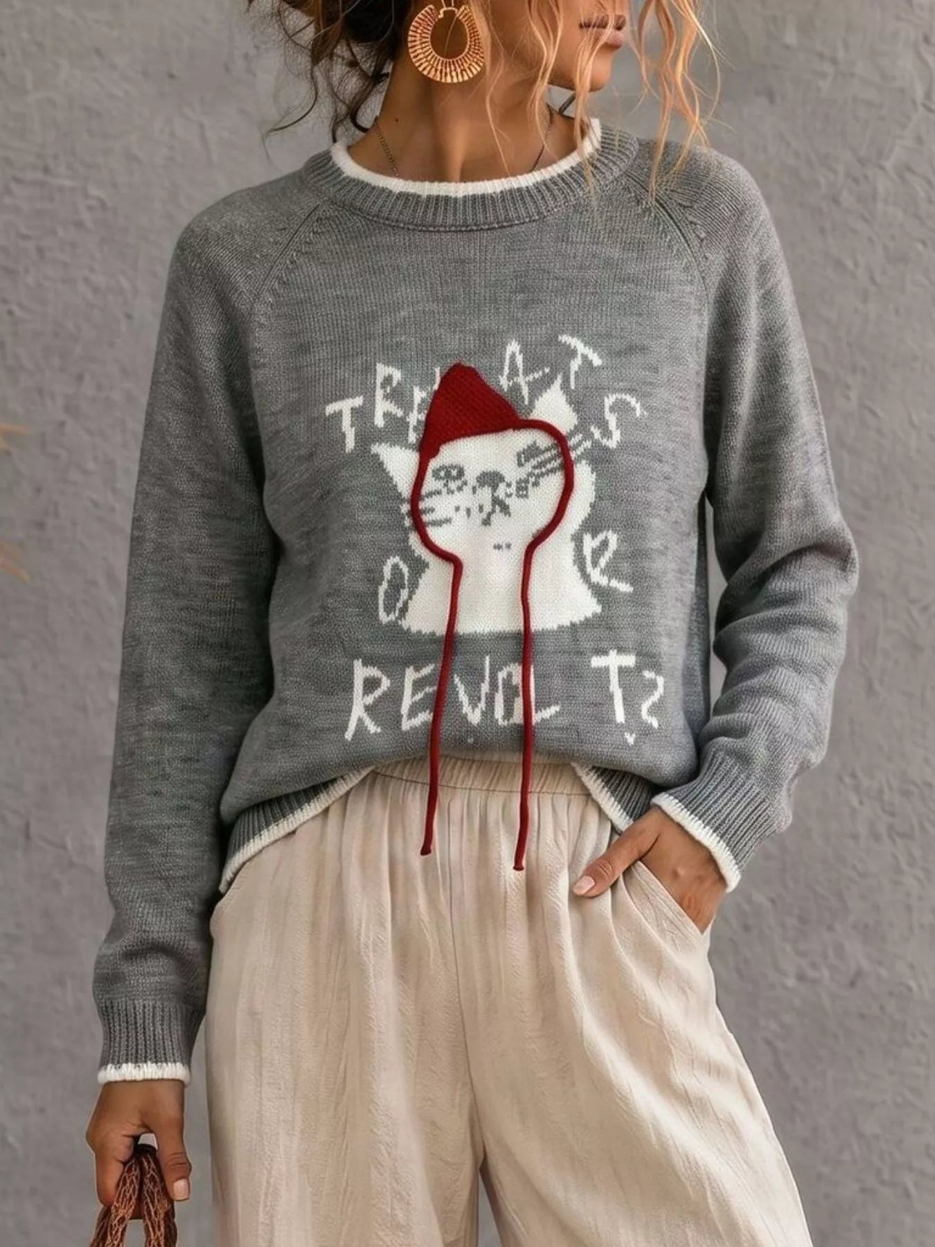 Gray cat sweater with white cat graphic and red hood strings