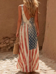 Back view of the off white American flag print maxi dress with deep V back and flowing skirt