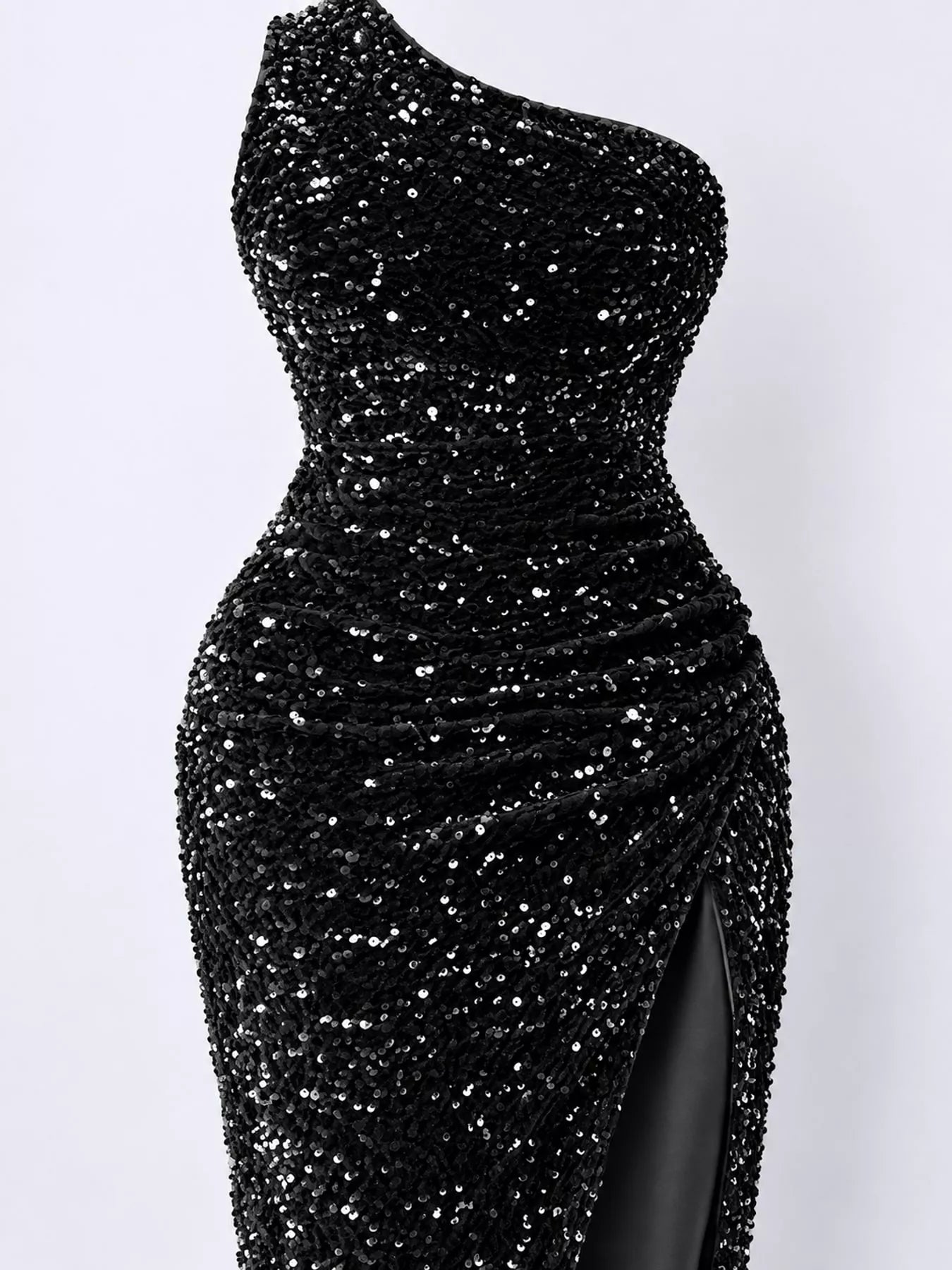 Black sequin one shoulder evening dress close view showing the ruched waist and sequin texture