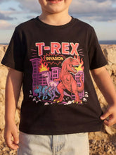 Front view of a children's black short sleeve tee with a red dinosaur city invasion graphic