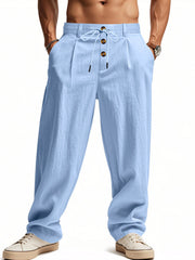 Men's light blue loose-fit pants with a drawstring waist and pockets.