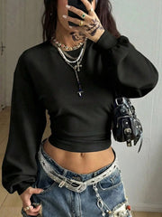 Front mirror view of black long sleeve cropped t shirt with wide sleeves