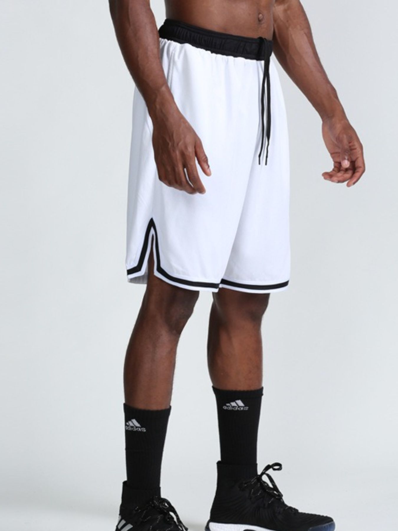 Men's white athletic shorts with a drawstring waist and pockets.