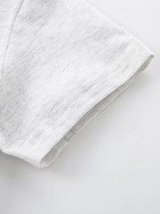 Close-up of the light gray heathered short sleeve hem with neat double stitching