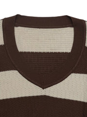 Close up of the ribbed V neckline on the brown and cream striped knit top