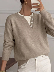 Mirror view of khaki dropped shoulder sweater with V neck and white buttons