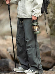 Men's dark gray tactical cargo pants with multiple pockets and a drawstring waist.