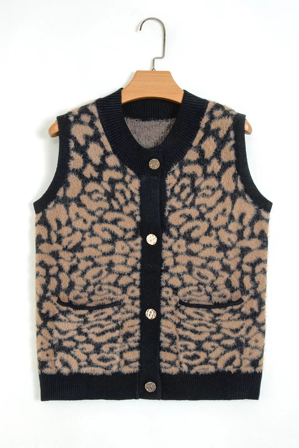Front view of leopard print knit vest on a hanger, with black trim and pockets.