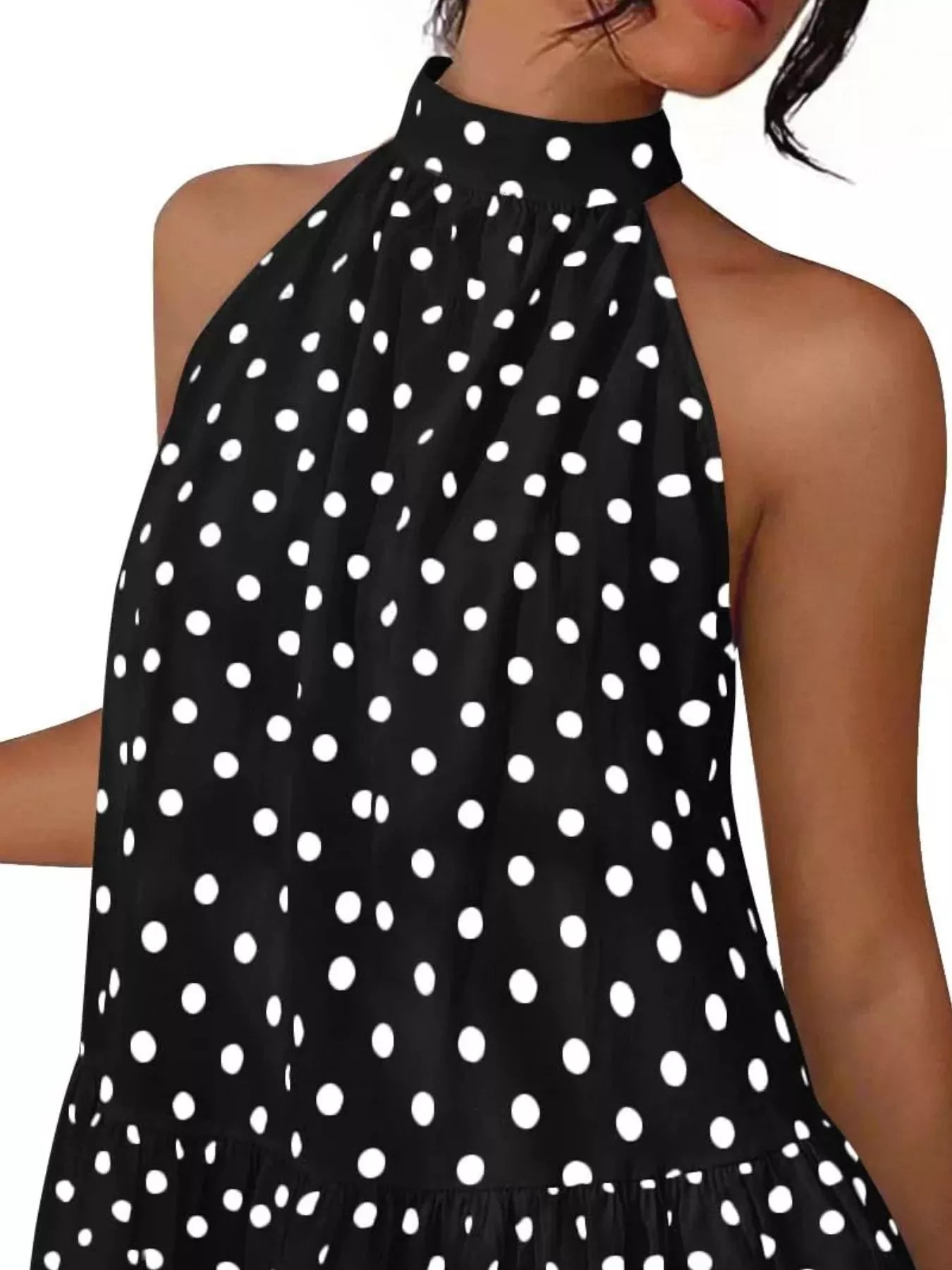 Close view of the black polka dot halter neck bodice and gathered neckline