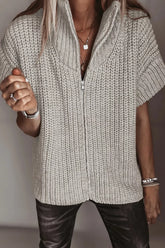 Light beige chunky knit sweater with short sleeves and partly open front zip