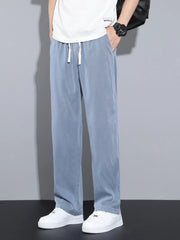 Men's blue casual pants with wide legs and a drawstring waist.