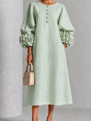 Full front view of the sage round neck midi dress with floral cuffs and small floral buttons