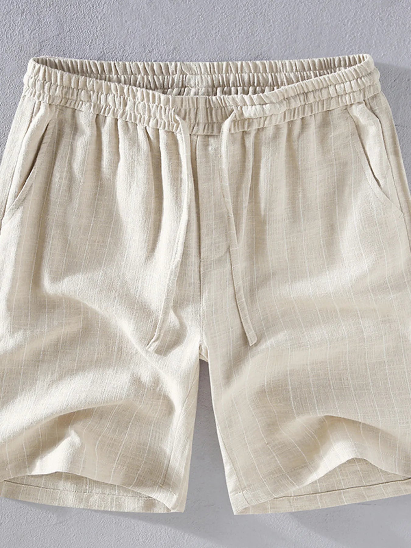 Men's khaki striped shorts with a drawstring waist, available in plus sizes.