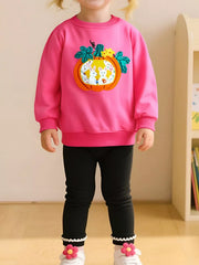 Front view of a strawberry pink children's sweatshirt with an orange pumpkin rabbit applique