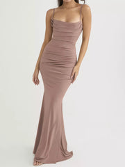 Front view of a dusty pink ruched spaghetti strap bodycon maxi dress in a studio