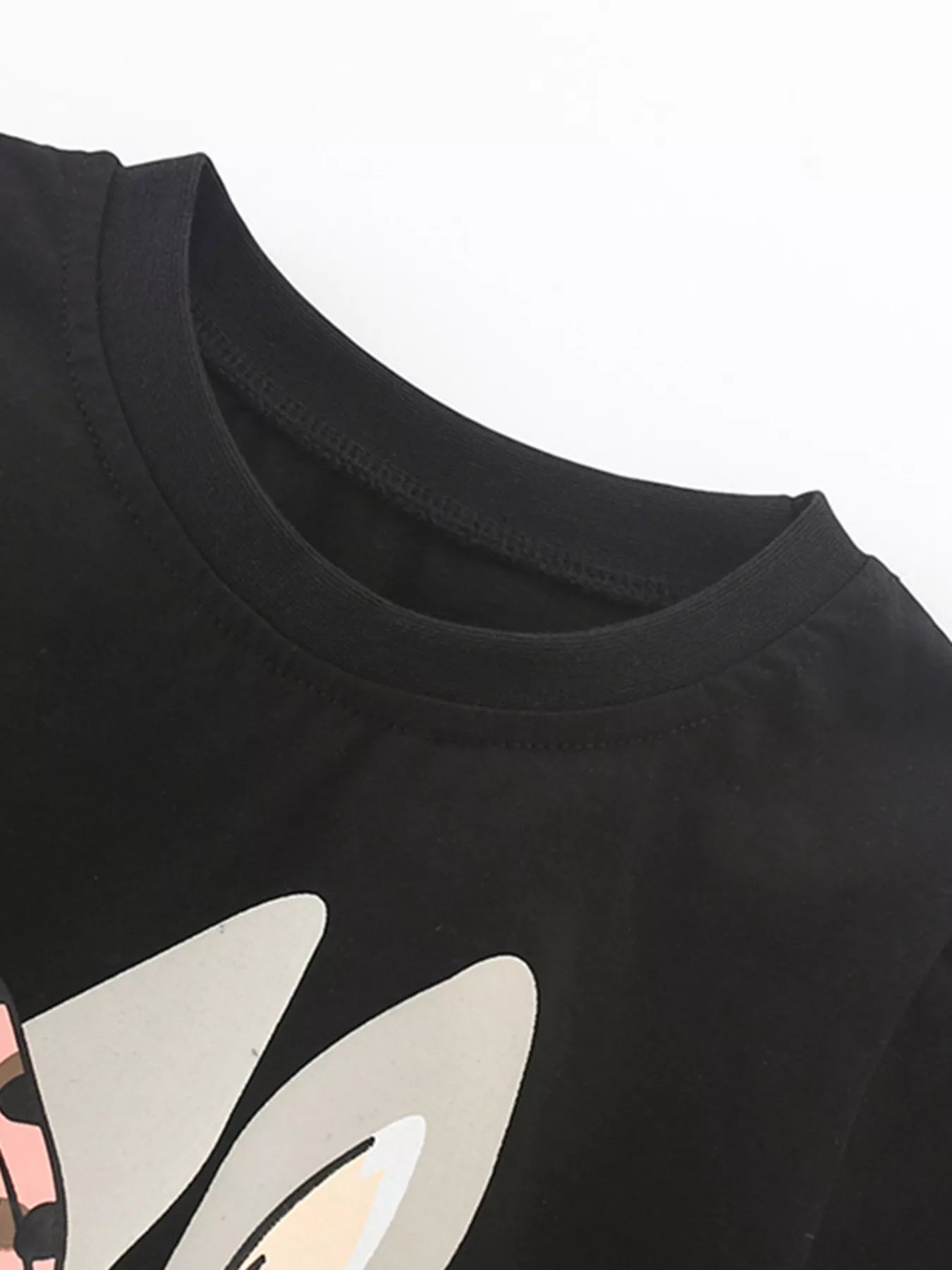 Close view of the black round neckline and the tops of the gray bunny ears