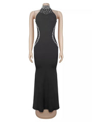 Black sleeveless maxi dress with pearl halter neckline shown on mannequin in front view
