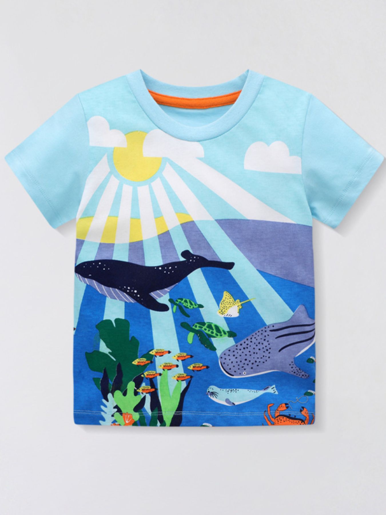 Pastel blue children's short sleeve t-shirt with a colorful ocean print of whales, turtles, and fish