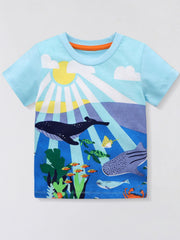 Pastel blue children's short sleeve t-shirt with a colorful ocean print of whales, turtles, and fish