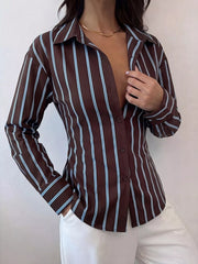 Close front view of chocolate striped button down shirt with collar and white trousers