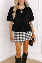 Blusa con cuello redondo y mangas abullonadas con aberturas