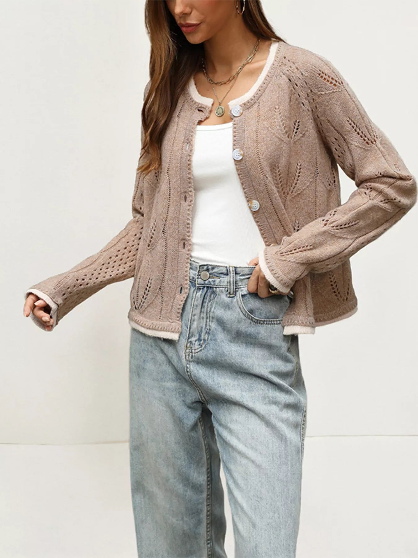 Side angle of the khaki hollow out cardigan with leaf pattern open
