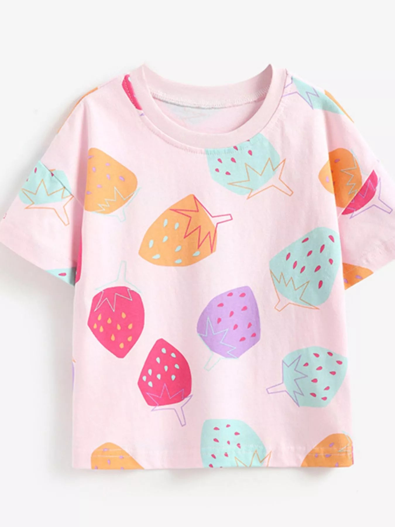 Front view of pink children's tee with all over colorful strawberry print