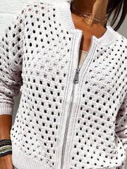 Front view of a white openwork crochet cardigan with a front zip