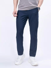 Men's navy slim-fit casual pants with pockets, available in plus sizes.