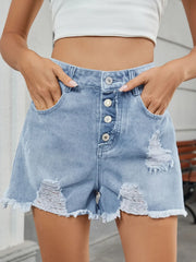 Women's distressed denim shorts with unfinished hems and a non-stretch fabric blend.