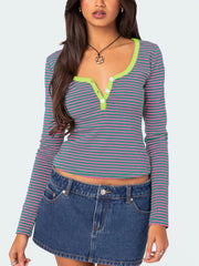 Green and pink striped long sleeve t shirt with lime trim and white buttons worn on model front view