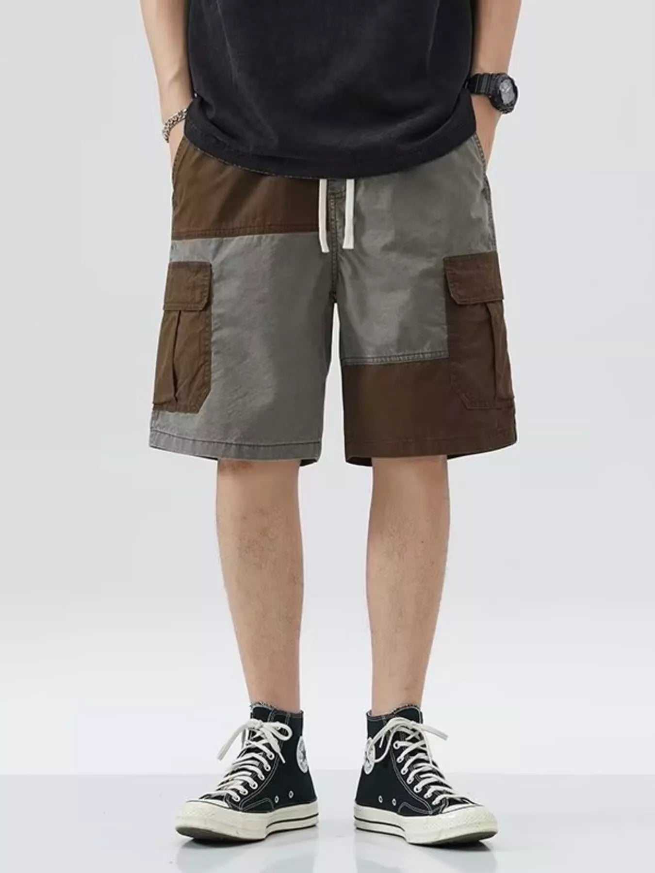 Men's gray two-tone cargo shorts with a drawstring waist and pockets.