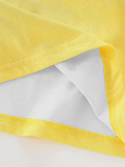 Close-up of the yellow fabric, stitching, and white lining at the hem of the children's t-shirt