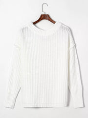 Back view of white ribbed knit sweater with round neckline and long sleeves on a hanger.