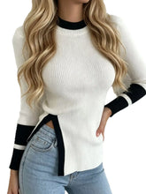 Off white ribbed sweater with black trim and side slit on model