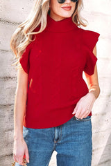 Outdoor front view of a red cable knit turtleneck sweater with ruffled short sleeves