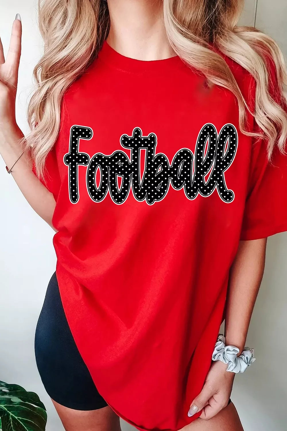 Deep red game day t shirt with black polka dot Football script lettering, front view