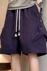 Men's purple drawstring shorts with pockets and lightweight fabric.