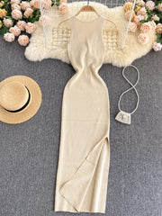 Cream white sleeveless knit bodycon midi dress, front view with side slit on hanger