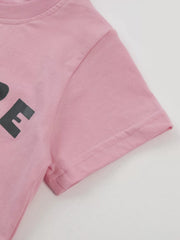Close up of the pink short sleeve hem and double stitching on the children's T-shirt